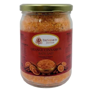 TriShakti Jyotish Orange Cinnamon Bath Salt glass jar on a white background.